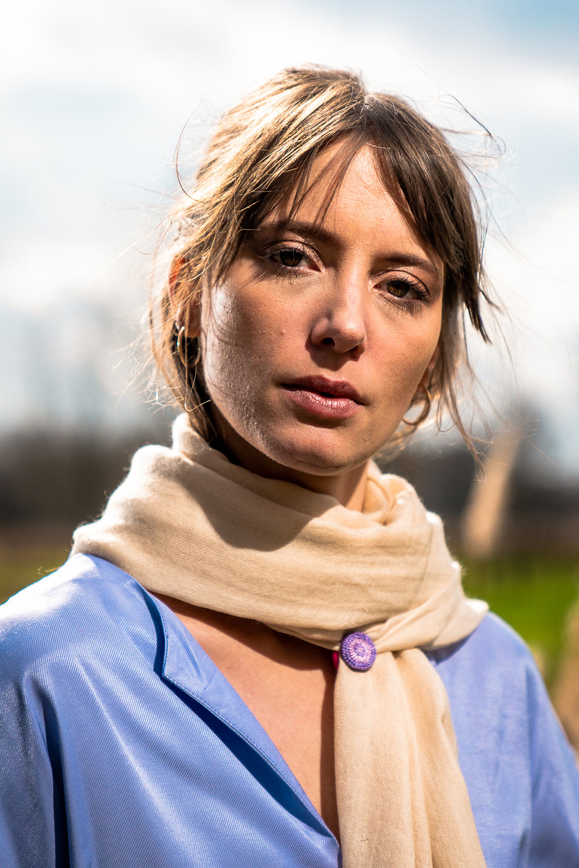 woman with a beige scarf