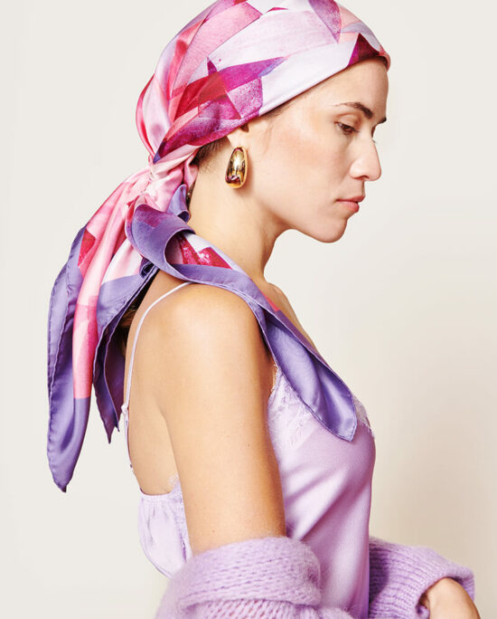 woman with a pink and purple scarf on her head