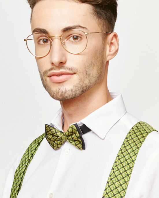 man with green suspenders and a green bowtie