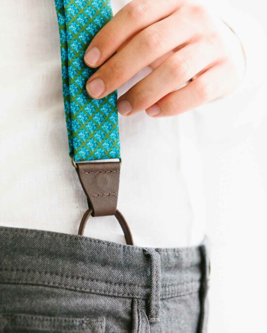 man with blue suspenders