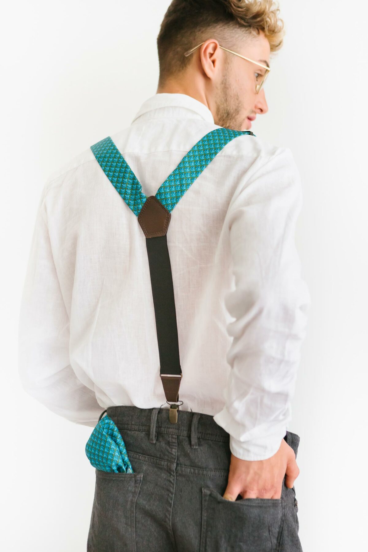 man with blue suspenders