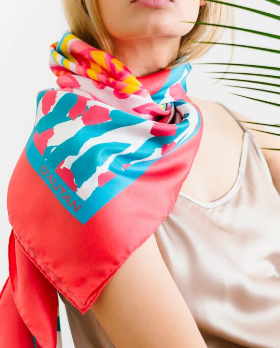 woman wearing a colourful scarf on her neck