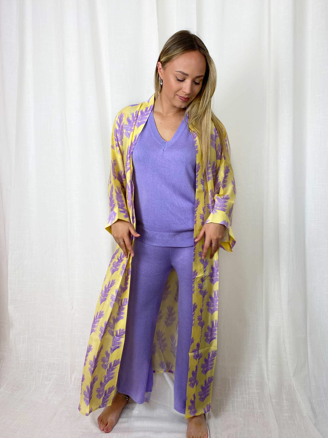woman with a lilac home suit and a yellow kimono