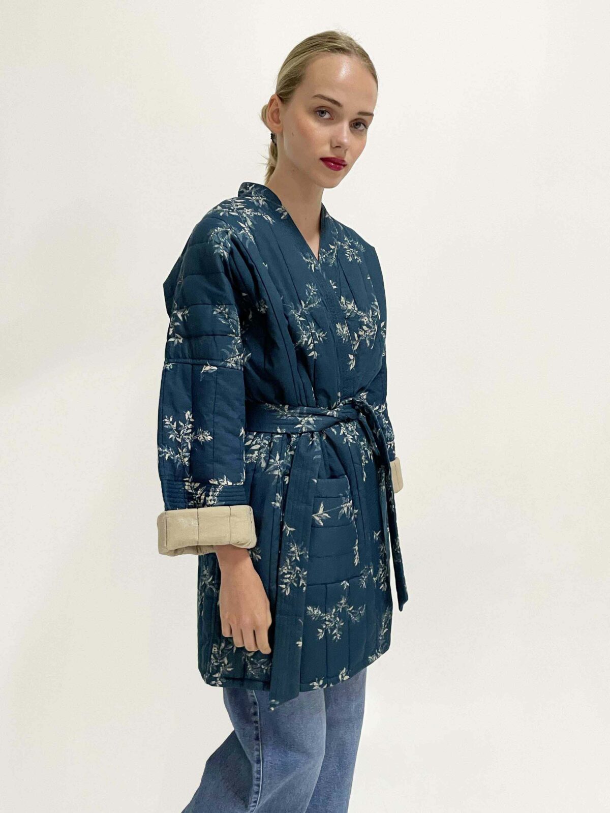 woman wearing quilted kimono coffee bean blue
