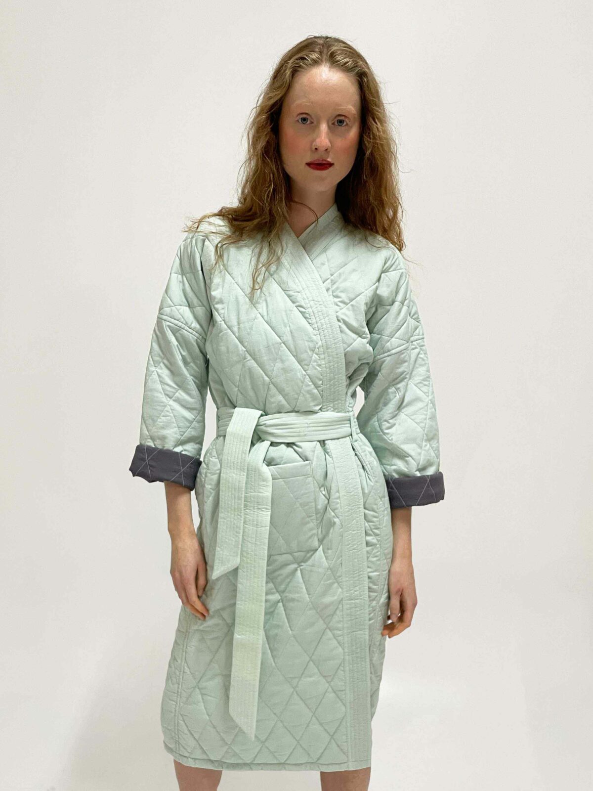 woman wearing quilted kimono demi sage mint